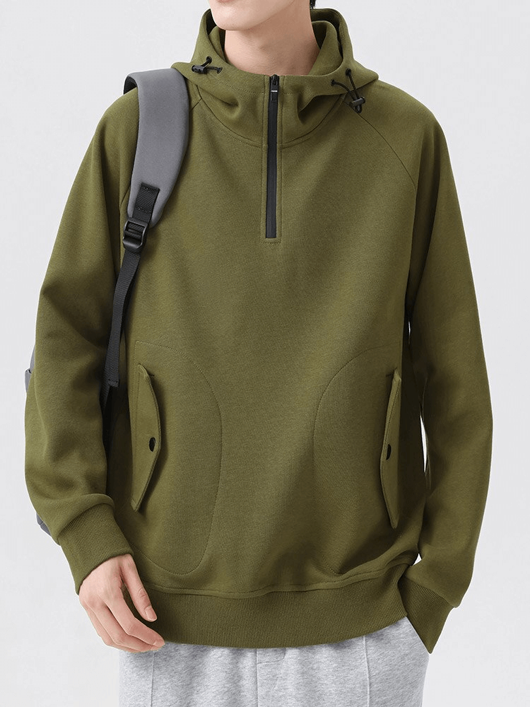 Green men's half-zip hoodie with pockets and hood, worn by person with backpack - Fashion SF1507
